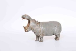 A COLD PAINTED BRONZE OF A HIPPOPOTAMUS, standing four square with mouth open wide,