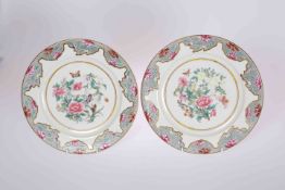 A PAIR OF ROYAL WORCESTER "FAMILLE ROSE" PLATES, each decorated by Po Hing, in Canton style,