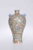 A CHINESE FAMILLE ROSE MILLE FLEUR VASE, of baluster form with kylin masks to the shoulders,