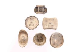 A COLLECTION OF SIX CHINESE WHITE METAL TRADE TOKENS. Gross 46.