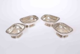 A SET OF FOUR GEORGE IV SILVER SALTS, John Cope Folkard, London 1821, with gadrooned rims. Gross 14.