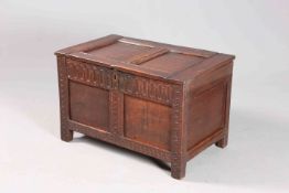 A SMALL 17TH CENTURY OAK COFFER, with two-panel lid and front,