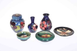 A GROUP OF MOORCROFT, comprising anemone ginger jar, anemone vase, poppy vase, poppy small dish,