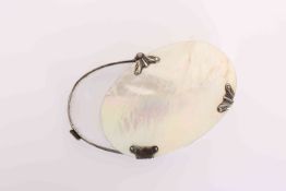 A GEORGIAN MOTHER-OF-PEARL AND SILVER MAGNIFYING GLASS, oval.