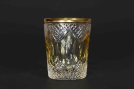 A 19TH CENTURY AMBER AND CLEAR GLASS BEAKER, with gilded rim. 10.