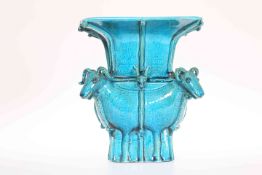 A CHINESE TURQUOISE GLAZED ZUN TYPE VASE, with flared square rim above four conjoined sheep,