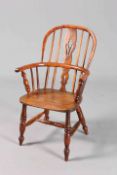 AN EARLY 19TH CENTURY YEW WOOD CHILD'S WINDSOR CHAIR, with panelled splat and H-stretcher.