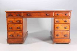 A VICTORIAN OAK DESK, the rectangular inset writing surface above three frieze drawers,