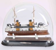 AN ALABASTER MODEL OF A SHIP, "VICTORIA", under a glass dome.