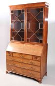 A GEORGE III MAHOGANY BUREAU BOOKCASE, the upper section with a pair of astragal glazed doors,