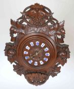 A LATE 19TH CENTURY BLACK FOREST WALL CLOCK, the case carved with fruiting vine,