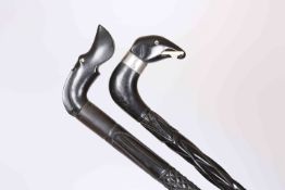 TWO EBONY WALKING CANES, one with silver collar hallmarked Chester 1926, each with bone details.