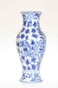 A CHINESE BLUE AND WHITE PORCELAIN VASE, painted with a four-claw dragon and foliage,