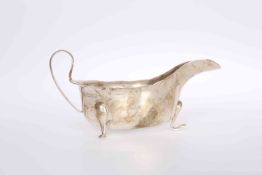 A GEORGE V SILVER SAUCE BOAT, Emil Viner, Sheffield 1931, with shaped rim and pad feet. 4.2oz, 14.