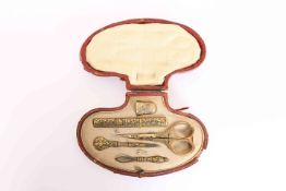 A 19TH CENTURY ETUI, comprising gold damascened needle case, leather point, loop threader,