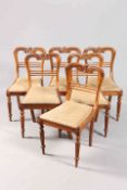 A SET OF SIX REGENCY ROSEWOOD DINING CHAIRS, with scroll carved back, raised on reeded legs.