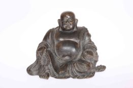 A CHINESE BRONZE OF A BUDDHA, cast seated holding beads, 18th or 19th Century.