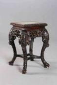 A CHINESE CARVED HARDWOOD JARDINIERE STAND, the square top with leaf-carved edge,