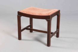 A GEORGIAN STYLE MAHOGANY AND UPHOLSTERED STOOL, with dished seat.