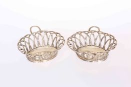 A PAIR OF GEORGE III SILVER WIREWORK BASKETS, John Henry Vere & William Lutwyche, London 1765,