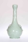 A CHINESE CELADON GLAZED BOTTLE VASE, with garlic neck and moulded "ring" handles.