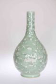 A CHINESE CELADON GLAZED PATE-SUR-PATE BOTTLE VASE, decorated allover with sprigs of foliage.