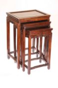 A SET OF THREE CHINESE ROSEWOOD NESTING TABLES, 19TH CENTURY,