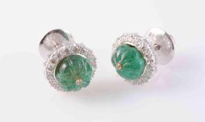 A PAIR OF EMERALD AND DIAMOND EARRINGS, the emerald bead engraved to depict six segments,