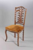 AN UNUSUAL CARVED CHAIR, with leaf design splat and cabriole legs.