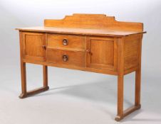 AMBROSE HEAL (1872-1959) AN OAK SIDEBOARD, CIRCA 1910/20,