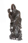 A LARGE CHINESE CARVED AND WIRE INLAID FIGURE OF A SAGE, modelled holding a scroll,