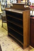 Medium oak open bookcase having three adjustable shelves,