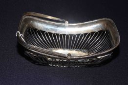 Silver swing handled cake basket with wire work body and beaded border, Chester 1910,