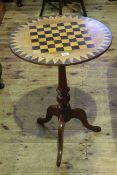 Circular inlaid games table on pedestal tripod base, 50cm diameter.