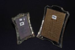 Two silver mounted easel photograph frames,