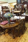 Early 20th Century oval mahogany Chippendale style extending dining table, two leaves and winder,