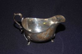 Silver half pint sauce boat with reeded border and shell and hoof feet, Birmingham 1917, 5.