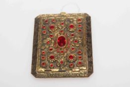 Fancy gilt metal compact with bright red stones