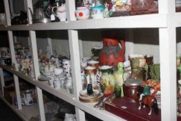 Full shelf of china including teaware, figurines, vases, swan planters, commemorative wares,