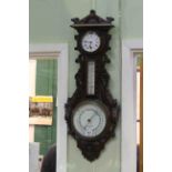 Negretti & Zambra carved oak clock barometer