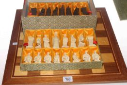 Boxed chess set with board and a wooden board