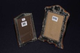 Silver mounted easel photograph frame with embossed decoration and a smaller silver frame (2)