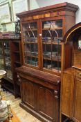 Victorian mahogany cabinet bookcase, having glazed doors above drawers and cupboards below,
