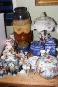 Collection of ornate ceramics including Chinese jar, Ringtons caddies, figure lamp,