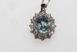 18 carat gold and oval aquamarine and diamond cluster pendant on chain, aquamarine approximately 1.