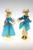 Pair of Italian glass extravagant figures in blue and gold costume,