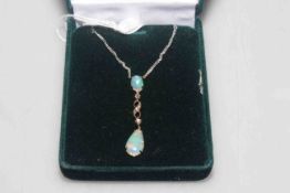 Opal and diamond pendant on a platinum chain