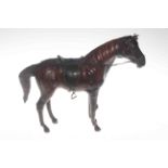 Leather model of a racehorse with saddle and bridle