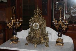 Ornate gilt metal clock garniture