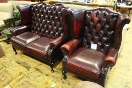 Ox blood buttoned leather two seater wing back settee and chair